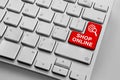 Keyboard with red online shopping theme buttons Royalty Free Stock Photo