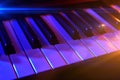Keyboard synthesizer with colorful lights in concert