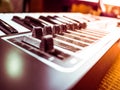 Keyboard of a synthesizer with sliders. Royalty Free Stock Photo