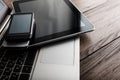 Keyboard with two phones and tablet pc Royalty Free Stock Photo