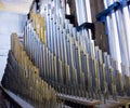 part of the church organ with many air pipes made of metal Royalty Free Stock Photo