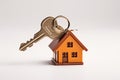 Keychain with house-shaped keys, concept of real estate and property management or mortgage