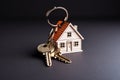 Keychain with house-shaped keys, concept of real estate and property management or mortgage