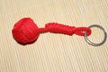 The keychain is made using macrame technique. The main knot is called monkey fist