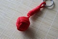 The keychain is made using macrame technique. The main knot is called monkey fist