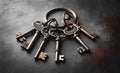 Keychain with old keys on textured background, copy space Royalty Free Stock Photo