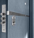 Keyhole And Bolts At Dark Blue Metallic Door Royalty Free Stock Photo