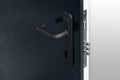 Keyhole and bolts at black white door with black handle