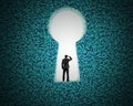 Keyhole on green big data background with businessman standing Royalty Free Stock Photo