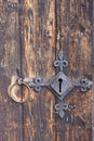 Keyhole of old metal lock on a wooden door. Royalty Free Stock Photo