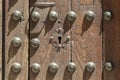 Keyhole in an old paneled wooden door with antique door handle Royalty Free Stock Photo