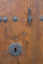 Keyhole in a rustic door. Royalty Free Stock Photo