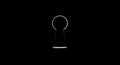 A keyhole silhouette is centered against a black background. The design features a Royalty Free Stock Photo
