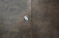 Keyhole steel knob on the grey wooden door Royalty Free Stock Photo