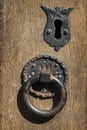 Keyhole on wooden door with metal handle Royalty Free Stock Photo