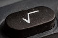 Keypad button showing square root symbol on modern electronic calculator for financial calculations