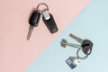 Keys from car and house on two colored background Royalty Free Stock Photo