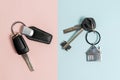 Keys from car and house on two colored background Royalty Free Stock Photo