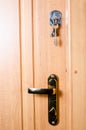 Keys at the door of the house room Royalty Free Stock Photo