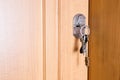 Keys at the door of the house room Royalty Free Stock Photo