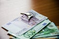 Keys, euro banknotes on the table, close-up