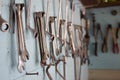 Keys in the garage tools. Old tools hanging on wall in workshop , Tool shelf against a wall  in the garage Royalty Free Stock Photo