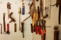 Keys in the garage tools. Old tools hanging on wall in workshop , Tool shelf against a wall  in the garage Royalty Free Stock Photo