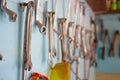 Keys in the garage tools. Old tools hanging on wall in workshop , Tool shelf against a wall  in the garage Royalty Free Stock Photo