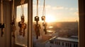 Keys Hanging by Window at Sunset