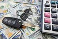 keys of house and car with calculator on us dollar money Royalty Free Stock Photo