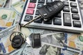 keys of house and car with calculator on us dollar money Royalty Free Stock Photo