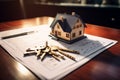 Keys, house model, and contract on a table, real estate