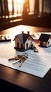 Keys, house model, and contract on a table, real estate