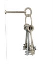 Keys Inserted Into White Wall Royalty Free Stock Photo