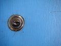 Keys and a keyhole on a blue door Royalty Free Stock Photo