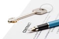 Keys of a new house and pen on contract. Royalty Free Stock Photo