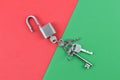 Keys and padlock over red and green background Royalty Free Stock Photo