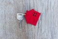The keys and the red house are placed on the table that is delivered to the customer. Mortgage, rental, purchase and home Royalty Free Stock Photo