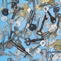 Keys set on blue background. Door lock keys and safes for property security and house protection. Different antique and new types Royalty Free Stock Photo