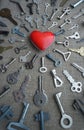 Keys strive to the red heart, vertical conceptual photo