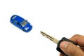 Right hand holding car key and car model for business concept Royalty Free Stock Photo