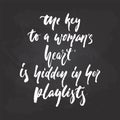The keys to a woman`s heart is hidden in her playlists - hand drawn Musical lettering phrase isolated on the black Royalty Free Stock Photo