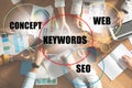 Keywords research concept. Team of SEO specialists working at table Royalty Free Stock Photo