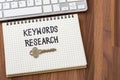 Keywords research on wooden table background Royalty Free Stock Photo