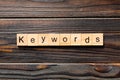 KEYWORDS word written on wood block. KEYWORDS text on wooden table for your desing, concept Royalty Free Stock Photo