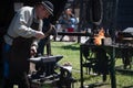 Blacksmith forging iron at The European Folk and Crafts Festival in Kezmarok, Slovakia