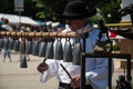 Handicraftsman plays on handmade cowbells at The European Folk and Crafts Festival in Kezmarok, Slovakia