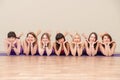 KHABAROVSK, RUSSIA - APR 18, 2019: A group of young sports people practicing yoga lesson with an instructor. Fitness club