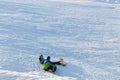 Khabarovsk, Russia - Dec 04, 2016: The girl instructor trains a teenager and a man snowboarding.