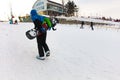 Khabarovsk, Russia - Dec 04, 2016: The girl instructor trains a teenager and a man snowboarding